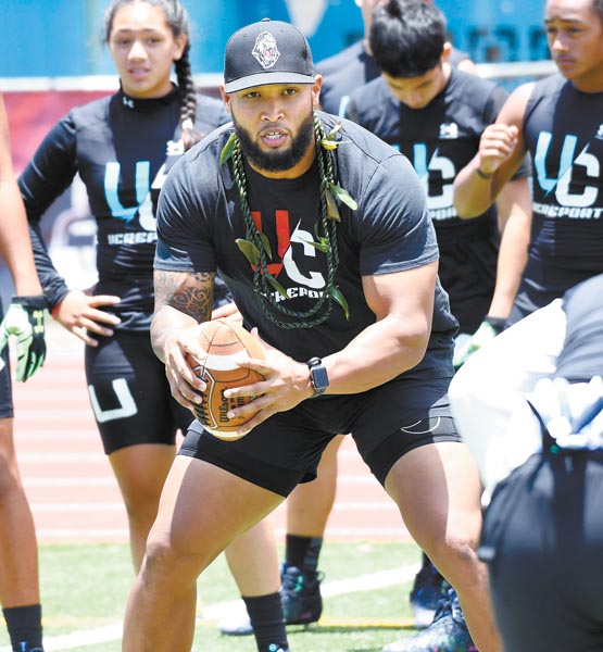 Jojo Disckson runs a drill for linebackers Saturday at King Kekaulike